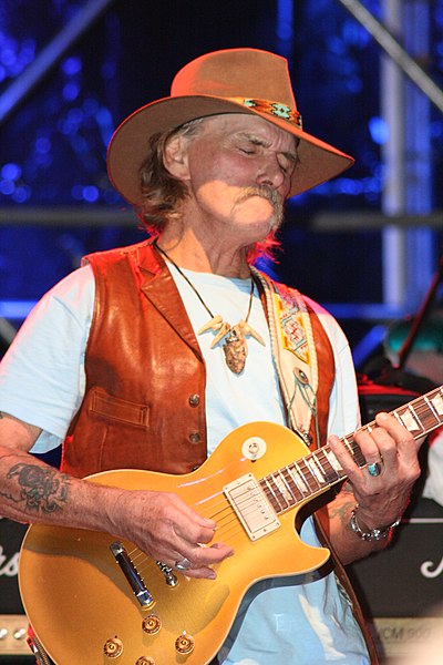 Dickey Betts of the Allman Brothers Band, brought elements of country rock into the band during the 1970s