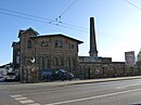 Municipal slaughterhouse with main building (slaughterhouse, machine house, boiler house), ancillary building (so-called Fettschmelze), administrator's house and roadside fence