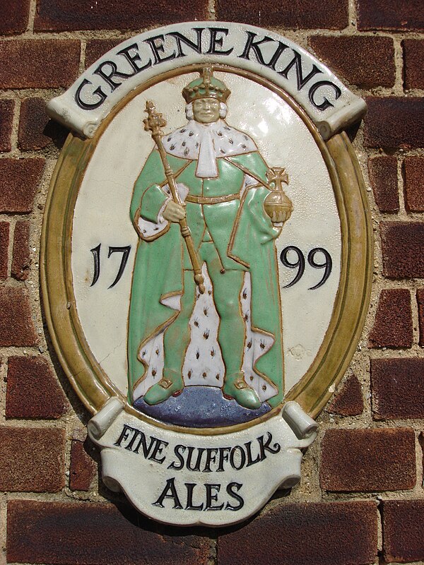 Greene King plaque on the side of a pub in Sudbury, Suffolk