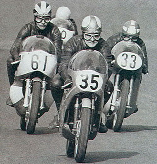 Read on 250 Yamaha number 61 following Mike Hailwood 35 with Rod Gould 33 close behind, around 1967 at Cadwell Park