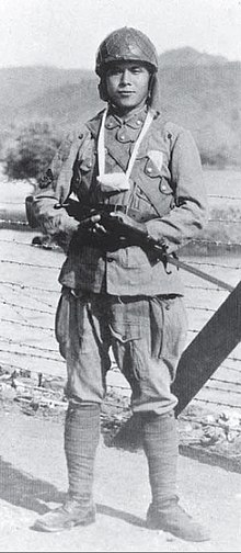 IJN Paratrooper wearing the green field uniform. IJN paratrooper,carrying ashes of fallen comrade.jpg