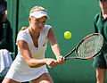 Katie Swan competing in the first round of the 2015 Wimbledon Qualifying Tournament at the Bank of England Sports Grounds in Roehampton, England. The winners of three rounds of competition qualify for the main draw of Wimbledon the following week.