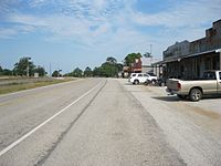 Looking southeast at some businesses on Loop 497. BNSF Railway is at left.