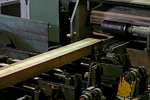 Laser guided cutting of wood in woodmill.jpg