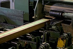 Wood traveling on sawmill machinery
