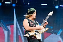 Sole constant member Takasaki reunited the original lineup of the band in 2001. Loudness - Wacken Open Air 2016 05.jpg