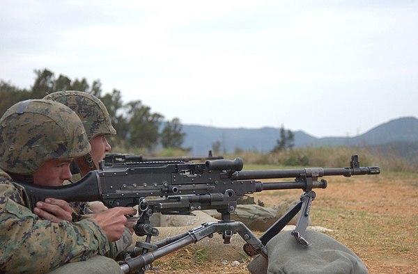 U.S. Marines firing an M240G at Camp Hansen, Okinawa