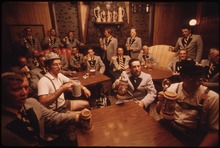 MEMBERS OF THE CONCORD SINGERS DRINK BEER AT THE TURNER CLUB IN NEW ULM, MINNESOTA. AS THEY PRACTICE GERMAN SONGS.... - NARA - 558262.tif