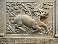Image 51Gilin with the head and scaly body of a dragon, tail of a lion and cloven hoofs like a deer. Its body enveloped in sacred flames. Detail from Entrance of General Zu Dashou Tomb (Ming Tomb). (from Chinese culture)
