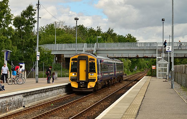A First ScotRail service approaching Muir of Ord with a service bound for Inverness