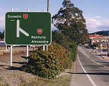 A typical New Zealand state highway junction sign: State Highways 1 and 85 meet in Palmerston, Otago. NZ-highway-junction.jpg