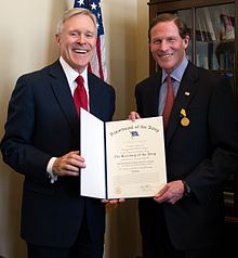 Secretary of the Navy Ray Mabus presents the Navy Distinguished Public Service Medal to U.S. Senator Richard Blumenthal Navy Distinguished Public Service Medal Awardee Richard Blumenthal.jpg