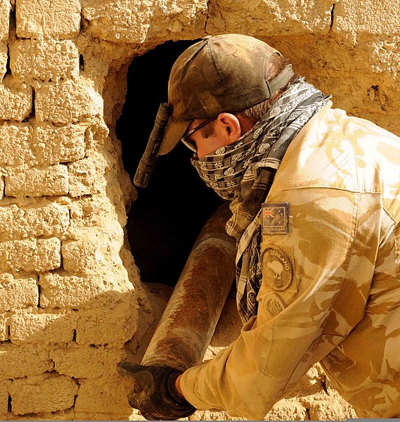 File:New Zealand Army 1st Lt. Nick Fisher, the officer in charge of the explosive ordnance detachment (EOD) of the New Zealand Provincial Reconstruction Team, removes a 107mm rocket from a wall in Bamiyan province 100830-A-QJ189-003.jpg