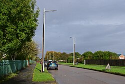 Old Stanton and Staveley and new Fabrikat lamp posts along Noddle Hill Way in Kingston upon Hull, as part of a replacement scheme of older lamp posts. The lanterns and other furniture attached to the spun concrete lamp posts will eventually be transferred to the new Fabrikat posts.