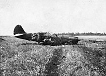A downed USAAF P-40E P-40E shot down Darwin 19 Feb 1942.jpg