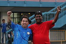 Admiralty FC team manager, R. Vengadasalam, and club owner, Donahue Francis, celebrate winning the Wolves' NFL Division 2 title on 30 June 2012. R. Vengadasalam and Donahue Francis.JPG