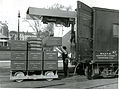 Workmen loading 10,000 pound weight onto the NBS railroad track scale testing truck to make a combined load of 90,000 pounds in addition to the 10,000 pound truck