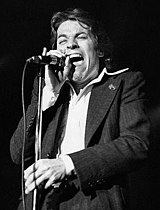 Robert Palmer collaborated with UB40 on "I'll Be Your Baby Tonight", which spent a week at number one in 1991. Robert-Palmer-Sunset-Strip-(edit).jpg