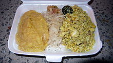 Shark chutney (right), with lentils and shredded green papaya on rice at a market on Mahe, Seychelles SeychellesSharkChutney.JPG