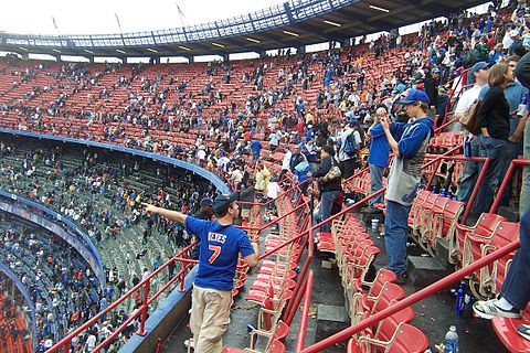 September 27: Fans staying after conclusion of the second-to-last game ever at Shea Stadium (and last Mets win), taking pictures and one last look.