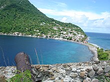 View of tombolo connecting mainland to Scotts Head (Cachacrou) peninsula Soufriere bay 2.JPG