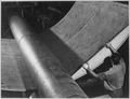 Steel under giant rolls being shaped for submarine construction at Electric Boat Company in Groton, Connecticut - NARA - 520848.tif