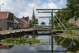 Stompwijk, Kirche (die Sint-Laurentiuskerk) entlang des Kanals (das Stompwijkse Vaart)