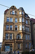 Apartment building with shop (including lattice gate)