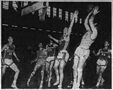 Leroy Chollet (center) contesting a shot from Danny Finn in the ABL The Tribune Mon Feb 4 1952.jpg