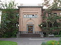 View of the front of Fenton Hall, on the University of Oregon campus in Eugene, Oregon. The words "School of Law" can be seen lightly above "Fenton Hall" on the front of the building. These were removed when the Law School moved from this building to what is now known as McKenzie Hall.