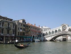 Venice in summer, with the Rialto Bridge in the background.