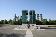 The Eternal Flame and 938 marble crosses on the National Memorial Cemetery of The Victims of Homeland War in Vukovar, commemorates the victims of the Vukovar massacre as one of the symbolic and crucial events in Croatian War of Independence Vukovar Memorial Cemetery - Eternal Flame, 20150429160745.jpg