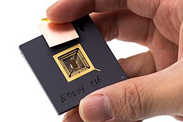 Yunsup Lee holding RISC V prototype chip.jpg