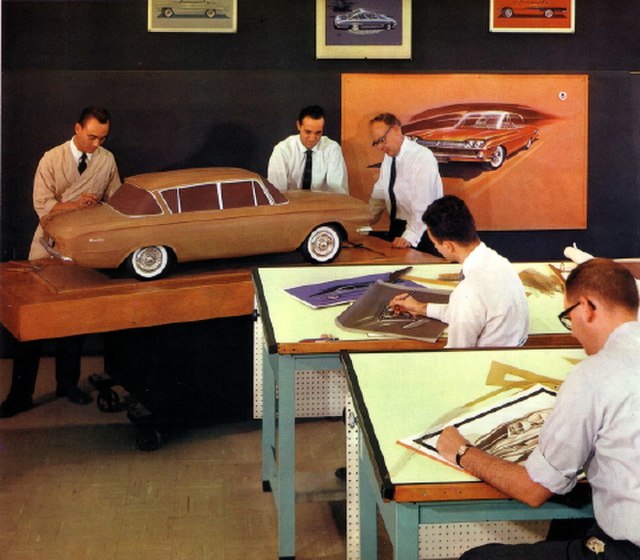 Designers at work in 1961. Standing by the scale model's left front fender is Dick Teague, an automobile designer at American Motors Corporation (AMC)