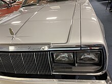 Rectangular sealed-beam headlamps with turn signal light below on a 1979 AMC Concord 1979 AMC Concord DL coupe silver 2021 AMO at Rambler Ranch 3of6.jpg