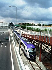 The Attiki Odos in Athens has commuter trains running in its median.