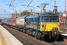 87002 working a GBRf charter through Wigan North Western 20160911-ACLG-87002 (cropped).jpg