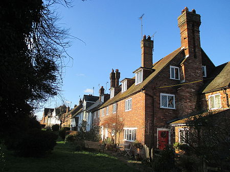 Alongside Cowfold churchyard