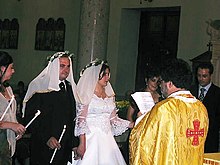 A couple marrying according to the Mystery of Crowning at a Byzantine Rite Catholic wedding Arberesh Byzantine Catholic wedding.jpg