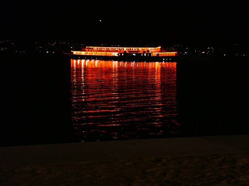 Versoix-beach at night with steamer