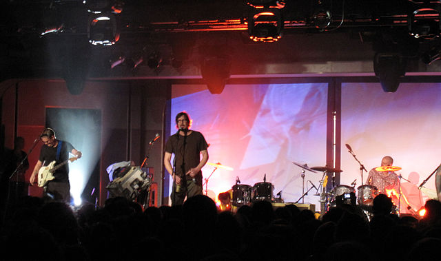 Butthole Surfers performing on December 6, 2008, in Minehead, England. This performance features strobe lights, smoke machines and a projected film in