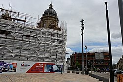 Both the Hull Maritime Museum and the 34-35 Whitefriargate, the former Burtons building, under scaffolding along Carr Lane in Kingston upon Hull.