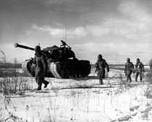 A column of the US 1st Marine Division move through Chinese lines during their breakout from the Chosin Reservoir. Chosin.jpg