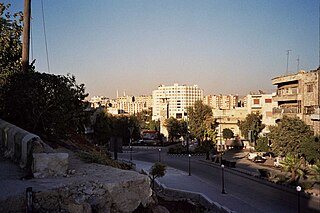 Climbing the Hama Citadel (48699882).jpg