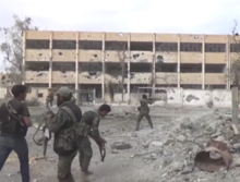 Syrian soldiers fighting in the streets of Deir Ez-Zor on 2 November Deir ez Zor street fighting.png