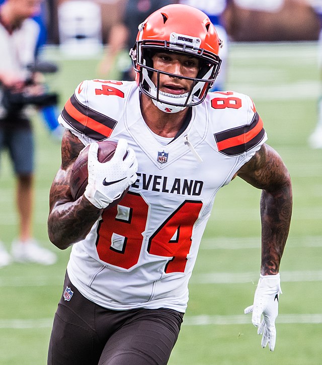 Cleveland Browns wide receiver Derrick Willies (84) holds off Cleveland  Browns defensive back Sheldrick Redwine (33) after a pass reception during  practice at the NFL football team's training facility Wednesday, July 31