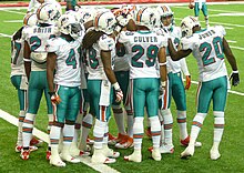 The Dolphins' defensive backs huddle during the preseason opener in Atlanta. Dolphins DBs 2011.jpg