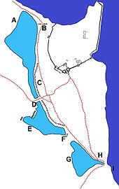 Surrounding landscape: A - North Mere; B - North Gate; C - earthen bank; D - West Gate; E - West Mere and fishponds; F - dam; G - South Mere; H - South Gate; I - harbour Dunstanburgh Castle environ map.jpg