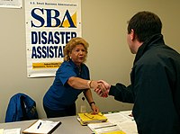 FEMA - 30747 - SBA worker shakes hands with FCO in South Dakota.jpg