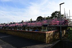 Renovation work underway on a row of council bungalows on Garrick Close on the Ings Estate, Kingston upon Hull, one of many renovation and revitalisation works carried out on council properties in Hull throughout 2023. See here for more details. The work, which got underway here in early September with the installation of scaffolding around the bungalows, will see among other things, the roofs of the bungalows replaced, new insulation fitted to the exterior of the bungalows, ventilators being fitted to kitchens and bathrooms, and doors and windows being replaced. The end result will see the insulated external walls being clad in white.